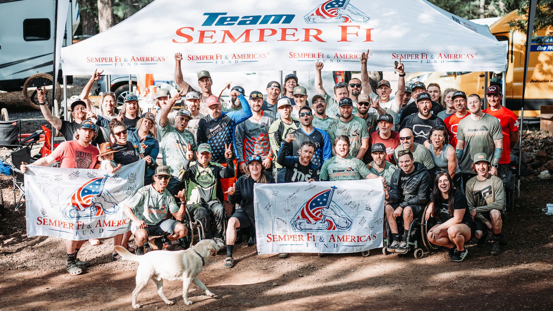 A group of people under a tent for Semper Fi & America's Fund