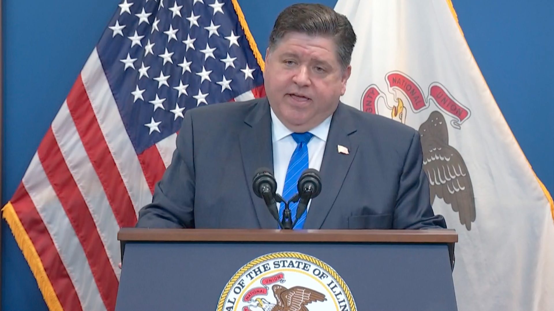 Photo of a man behind the podium 