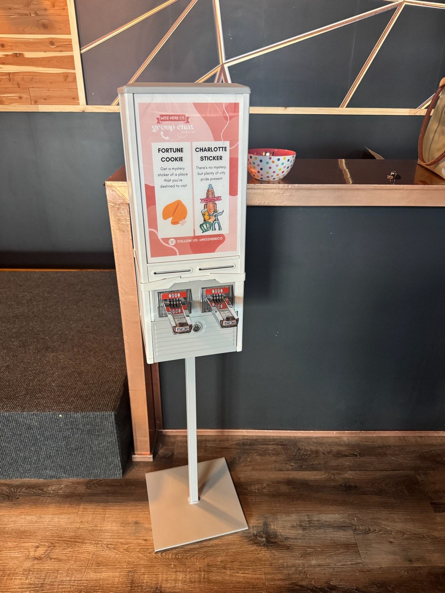 an old vending machine that says custom stickers on it