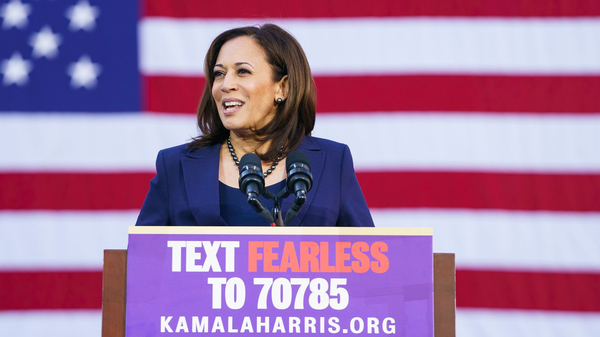 Kamala Harris behind a podium at her campaign announcement