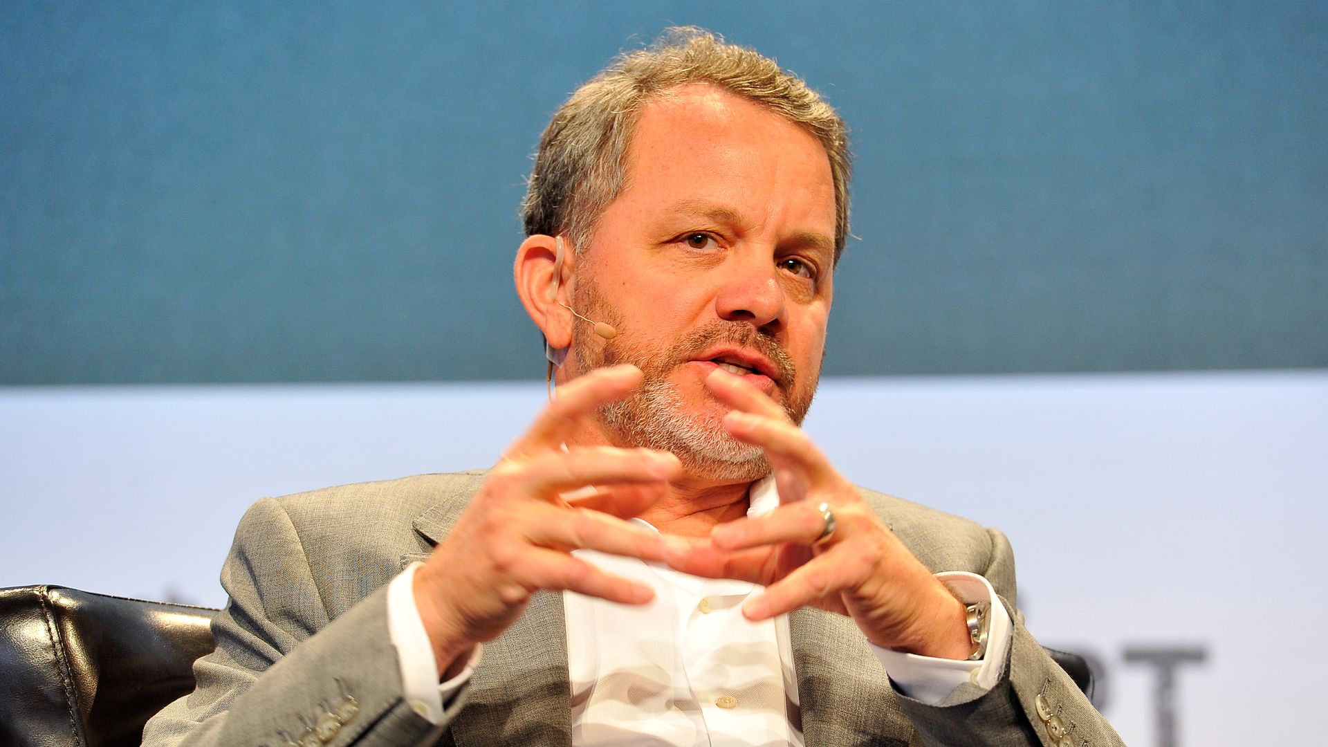 Photo of TPG Capital partner Bill McGlashan speaking at a conference.