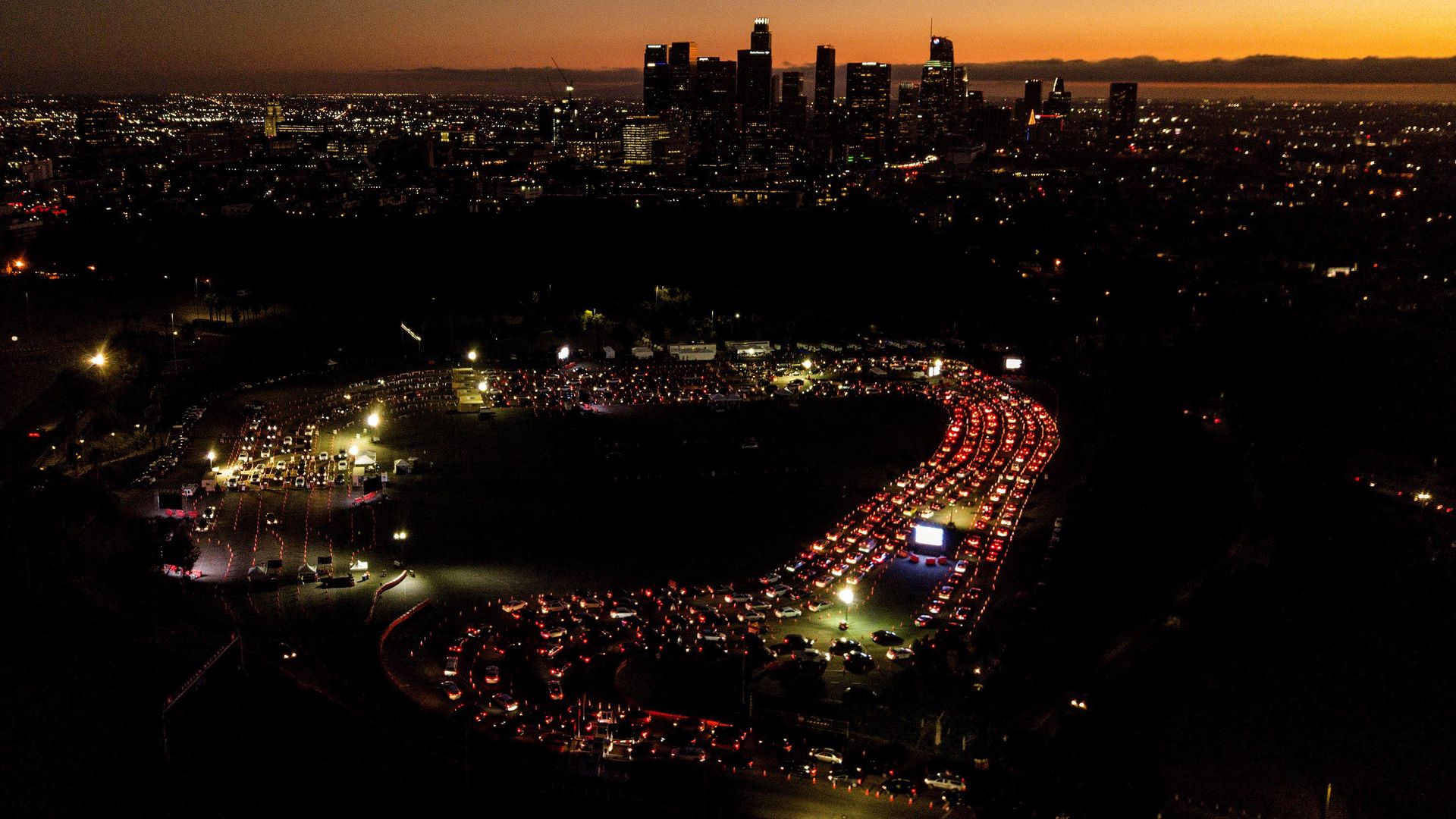 Picture of cars snaking around Dodger Stadium as Angelenos wait for coronavirus tests in the ballpark parking lot.