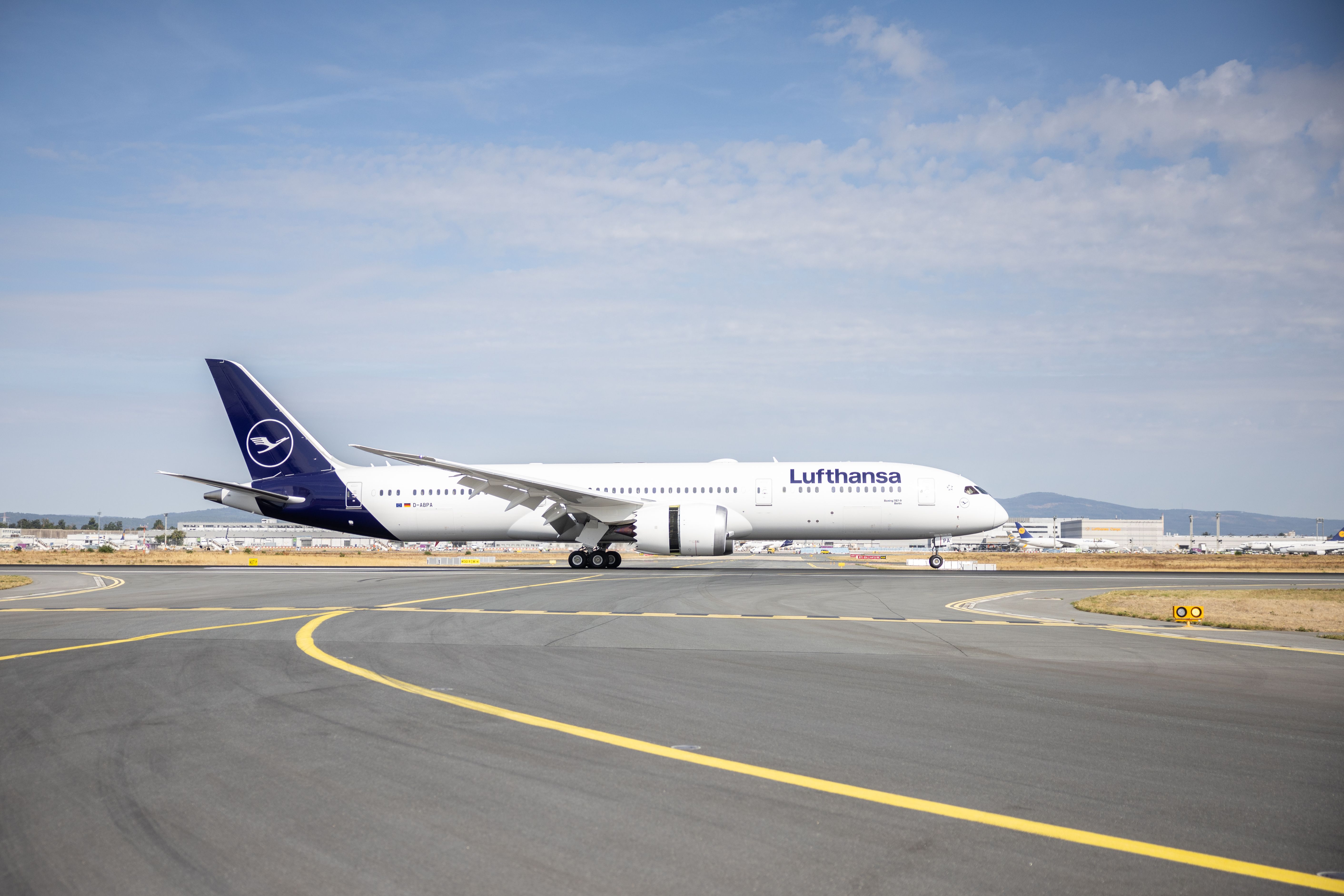 A photo of a Lufthansa Boeing 787-9 airplane sitting on the tarmac