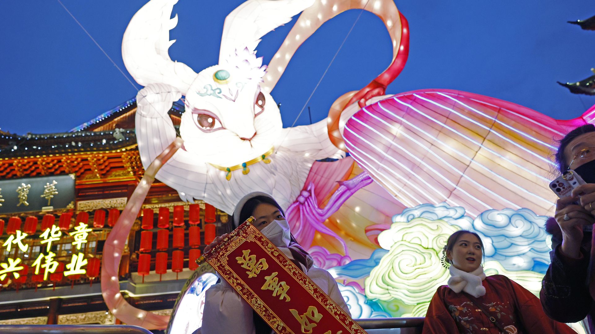 Tourists pose for photos in front of an illuminated rabbit lantern during a lantern fair at Yuyuan Garden on New Year's Day on January 1, 2023 in Shanghai, China.