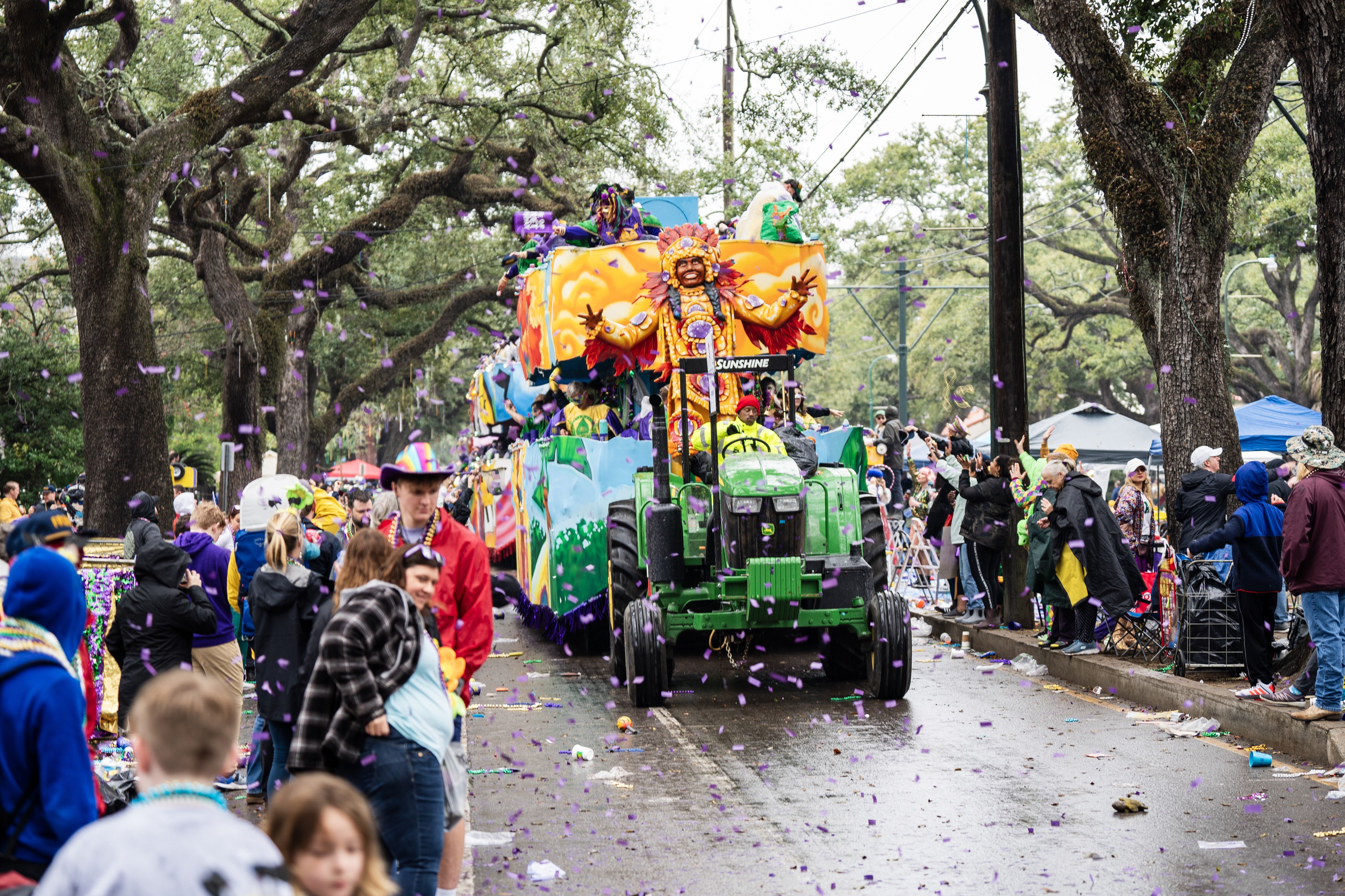 A float rides down a wet parade route.