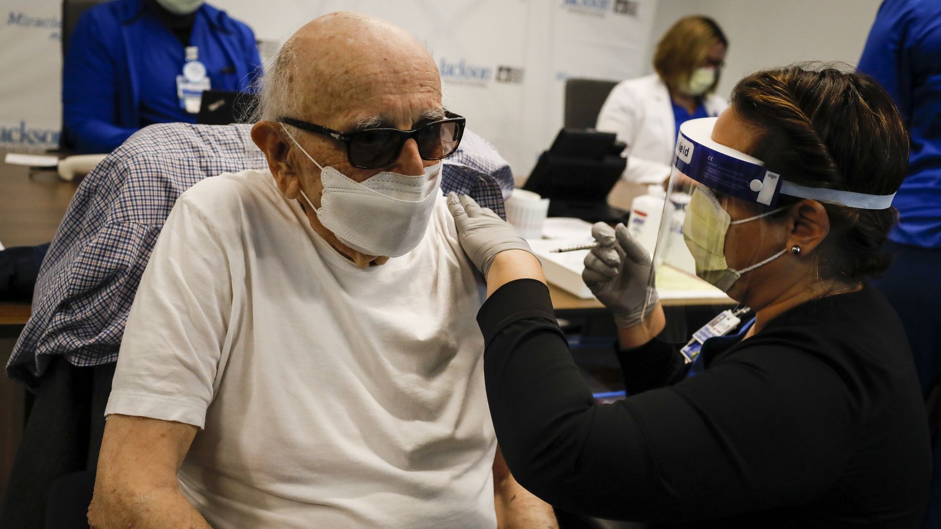 A healthcare worker giving a patient a dose of Pfizer/BioNTech's coronavirus vaccine in Miami on Dec. 30.