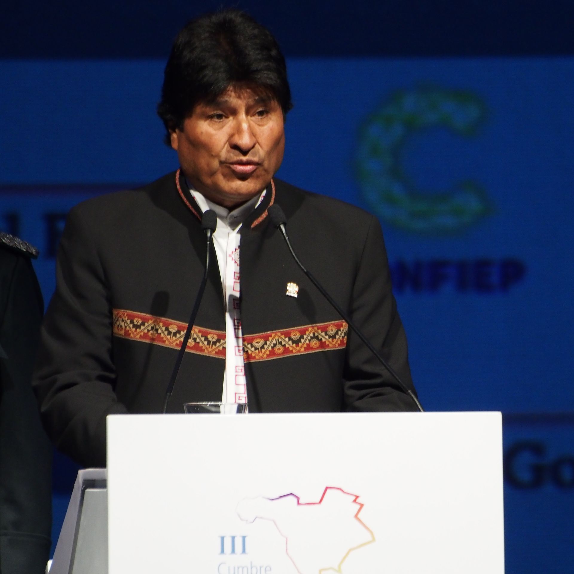 Evo Morales speaking at a lectern