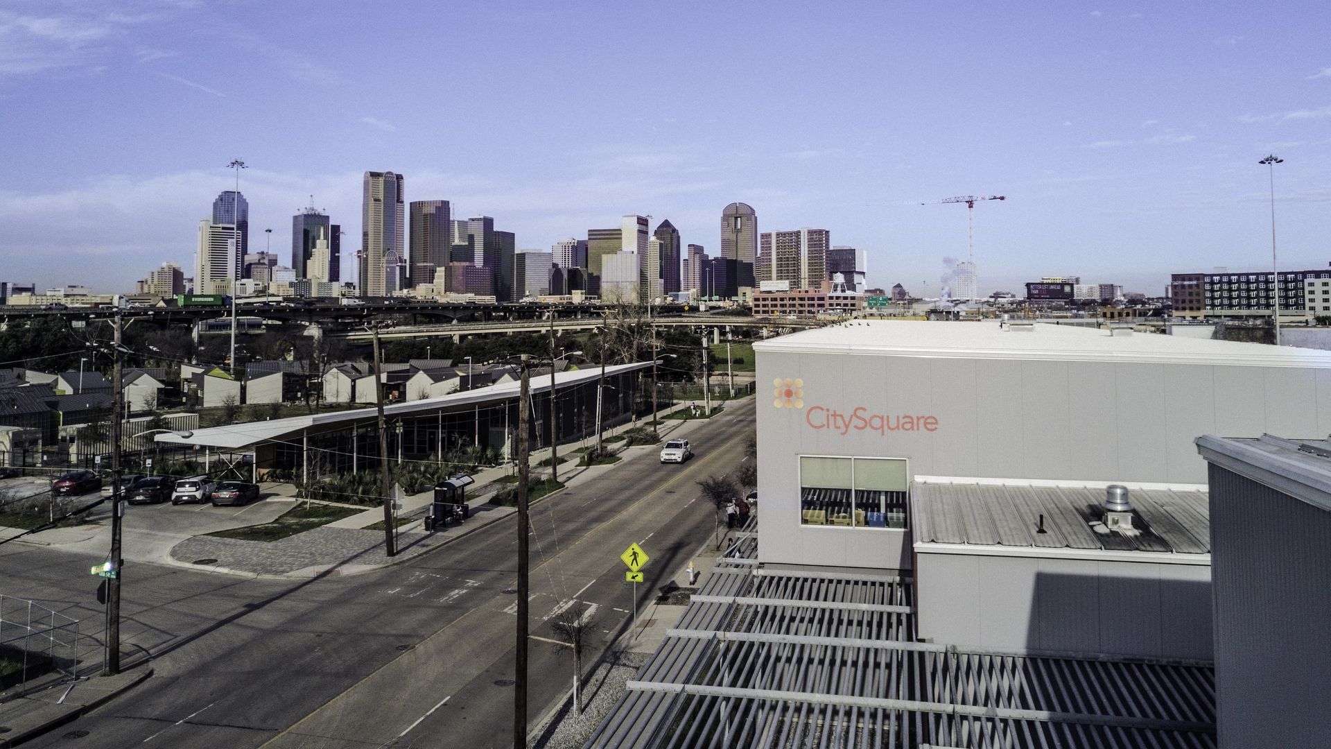 A building with a "CitySquare" sign with a skyline in the background