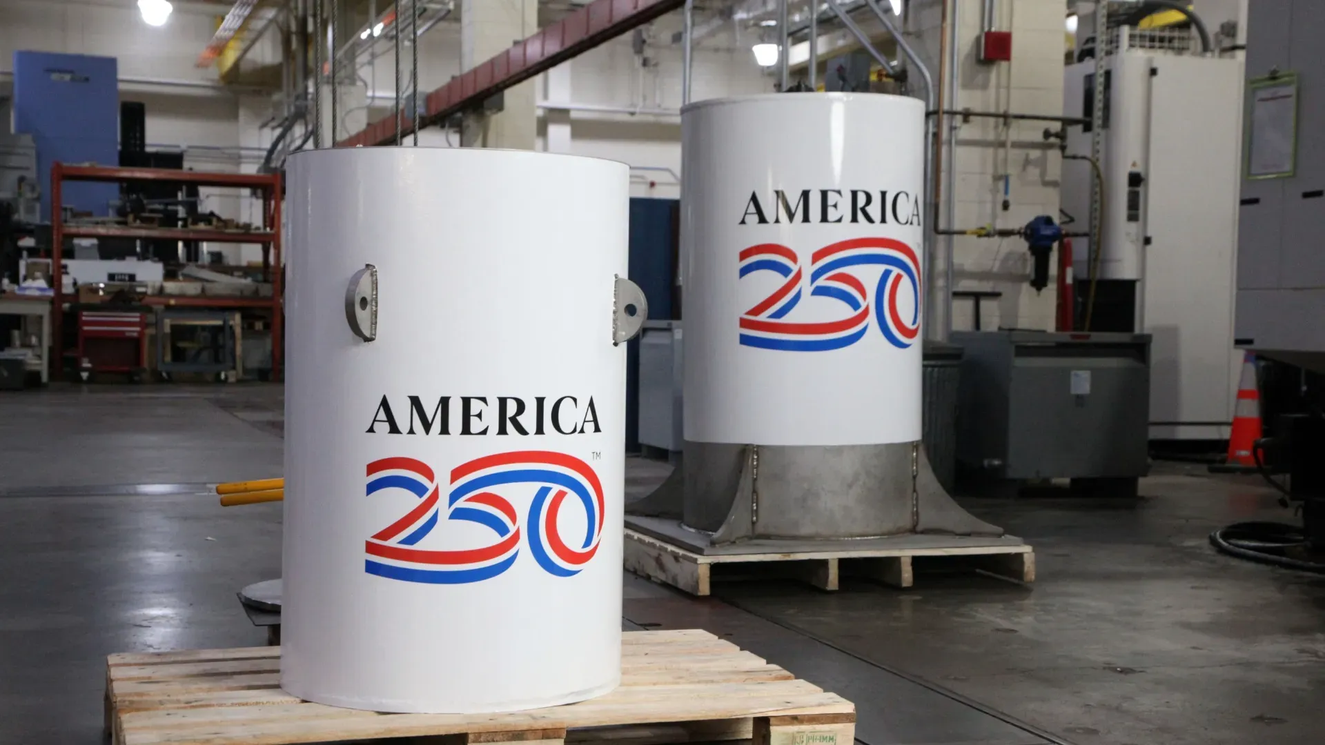 The America250 time capsule, left, and the bell jar that will fit on top of it.