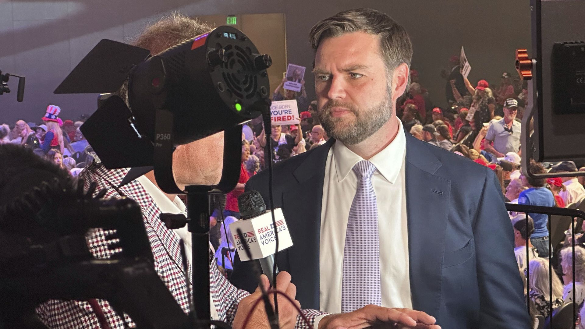 Sen. J.D. Vance (R-Ohio) speaks to reporters at a Turning Point Action event with former President Trump in Phoenix on June 6