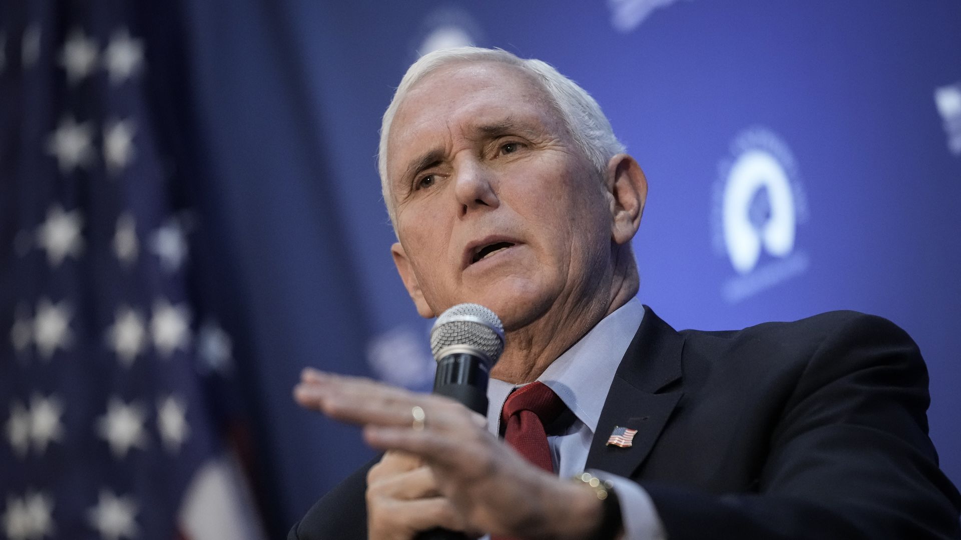 Photo of Mike Pence speaking into a mic