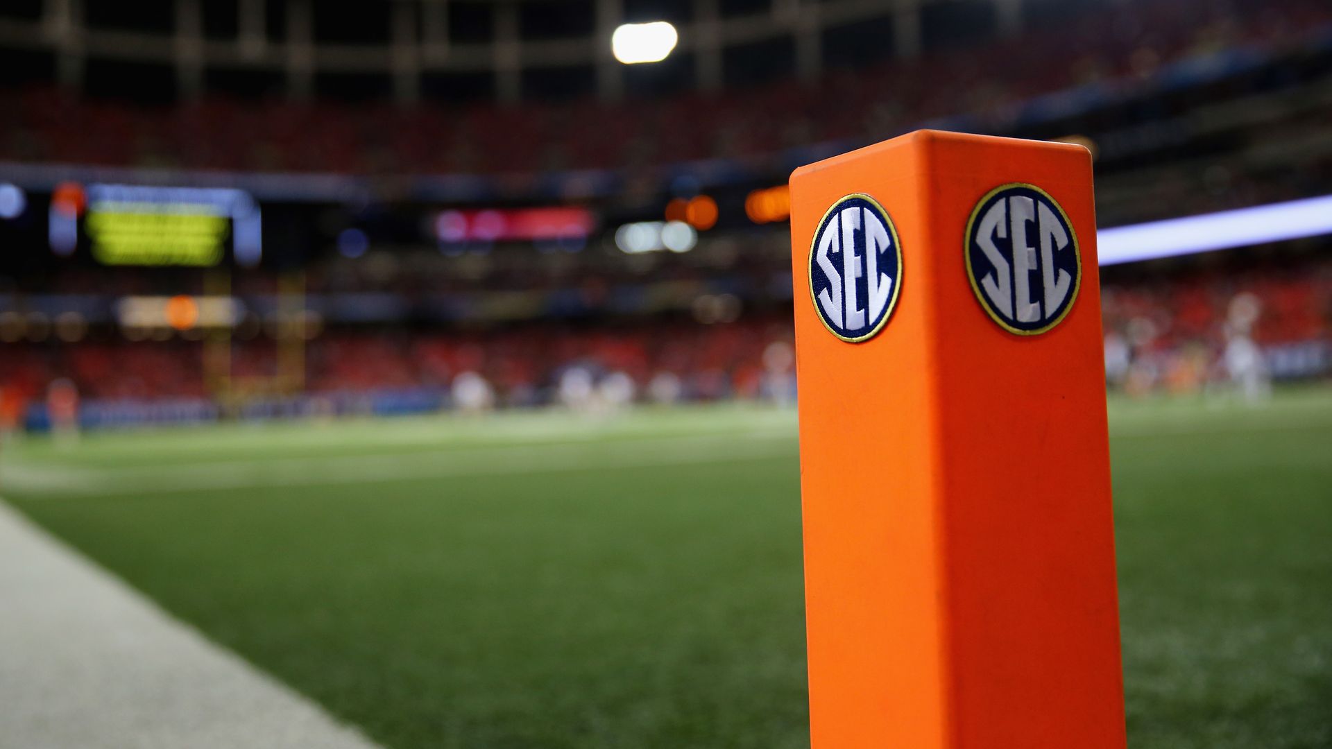 A SEC logo on an end zone pylon.