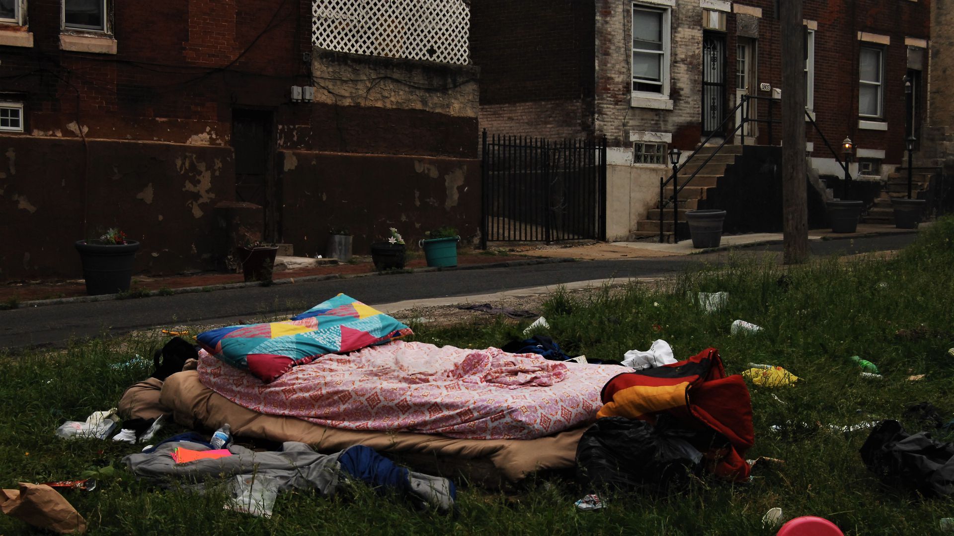 Empty bed on a trashed lawn
