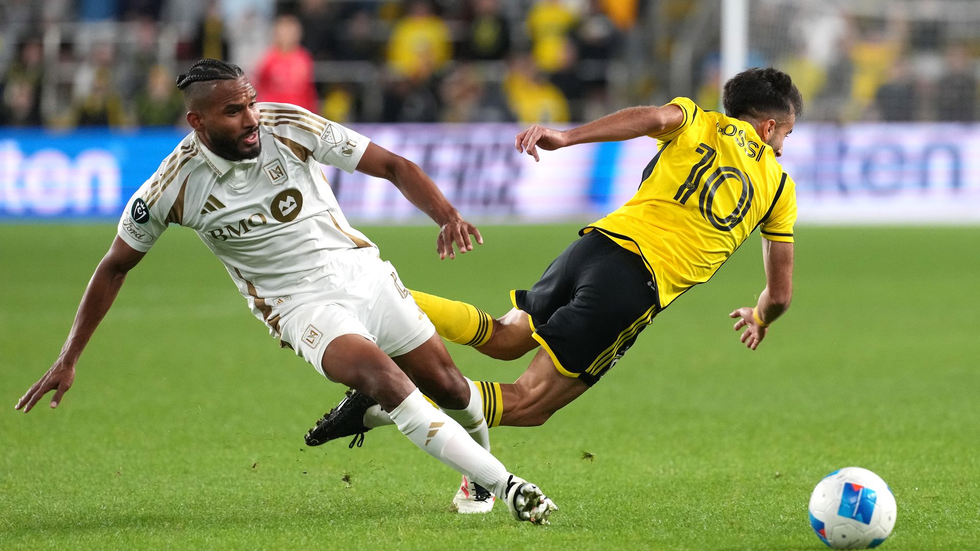 LAFC defender Eddie Segura fouls Columbus Crew forward Diego Rossi
