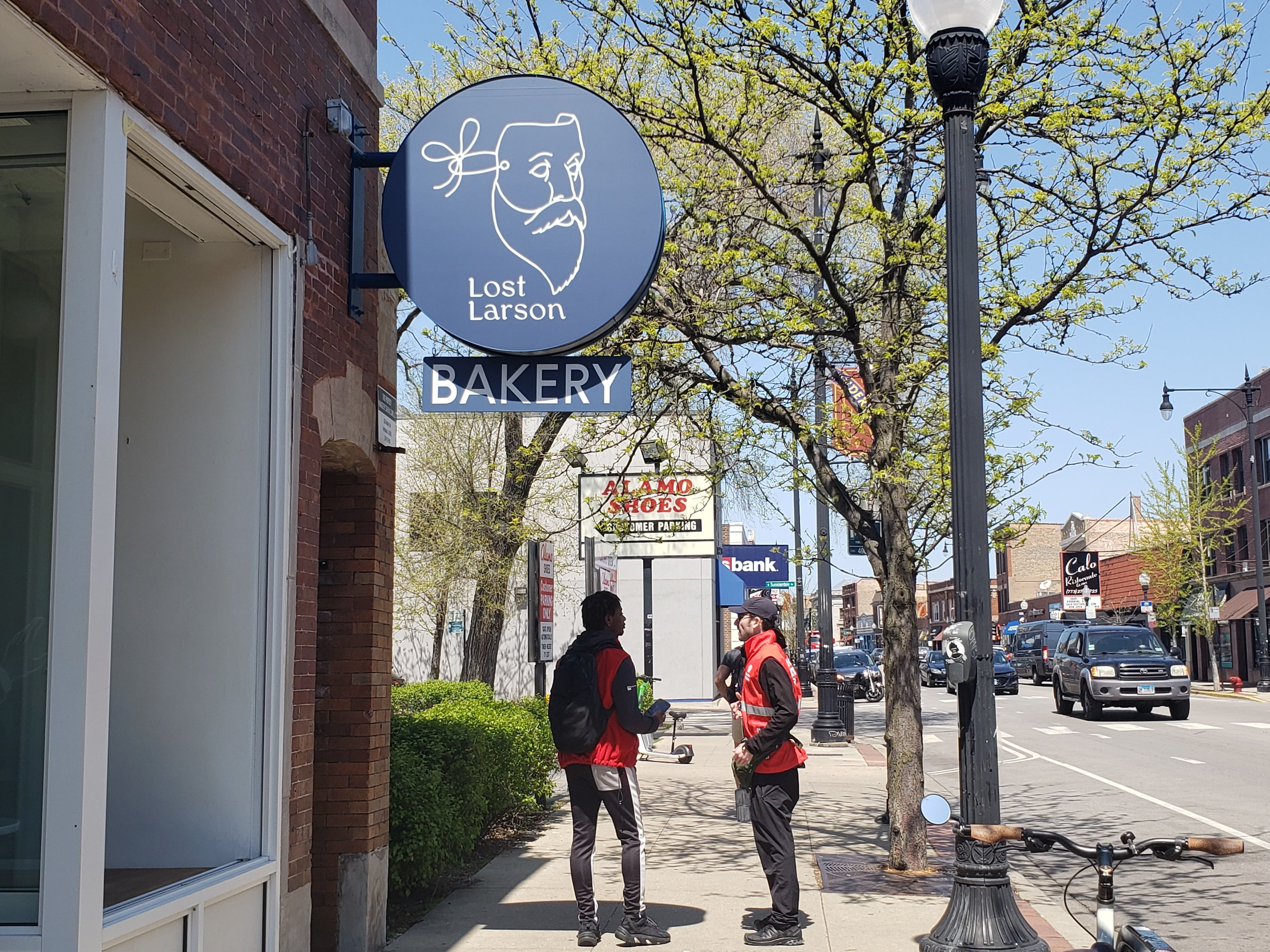 Photo of the front of a store with a sign that says "Lost Larson"