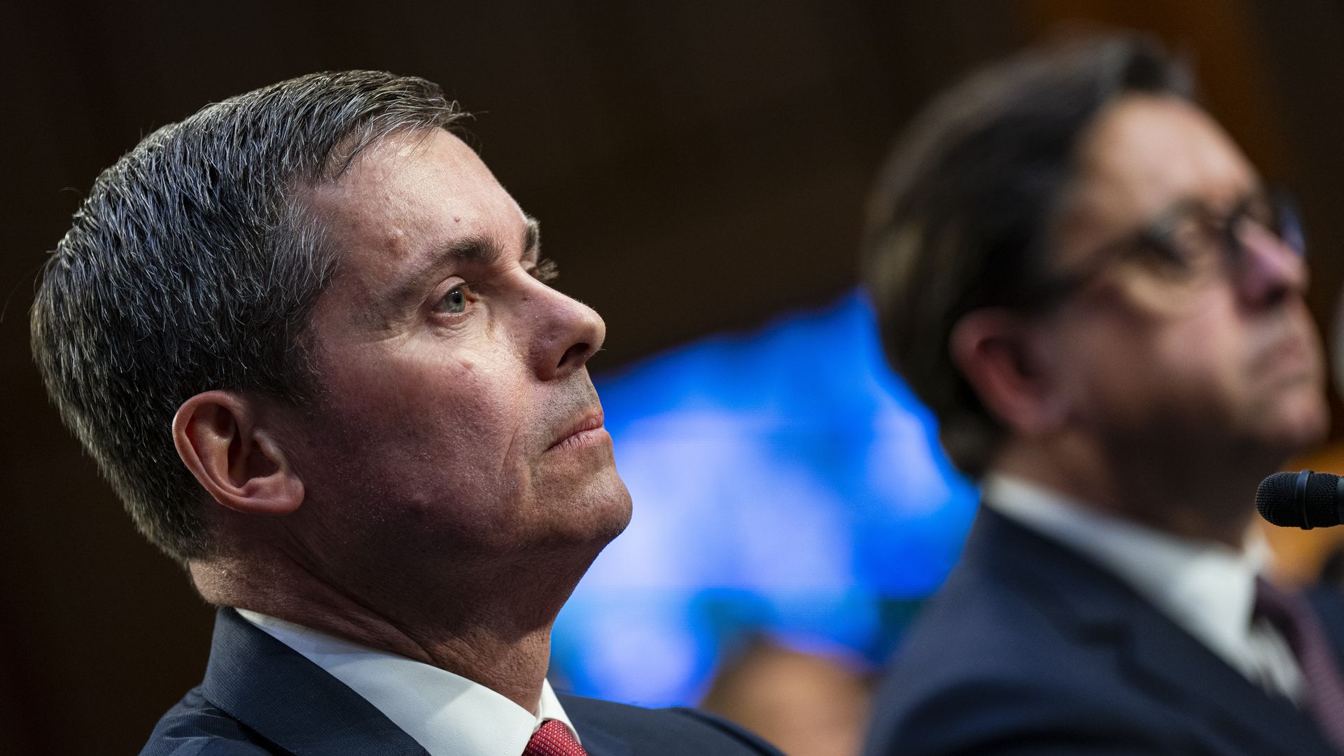 Eli Lilly CEO David Ricks listens at a Senate HELP Committee hearing on insulin