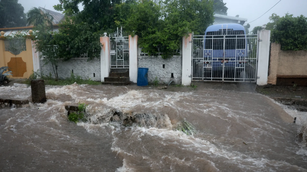 Floodwaters pour onto the street as Hurricane Beryl passes through Kingston, Jamaica, on Wednesday, July 3. 