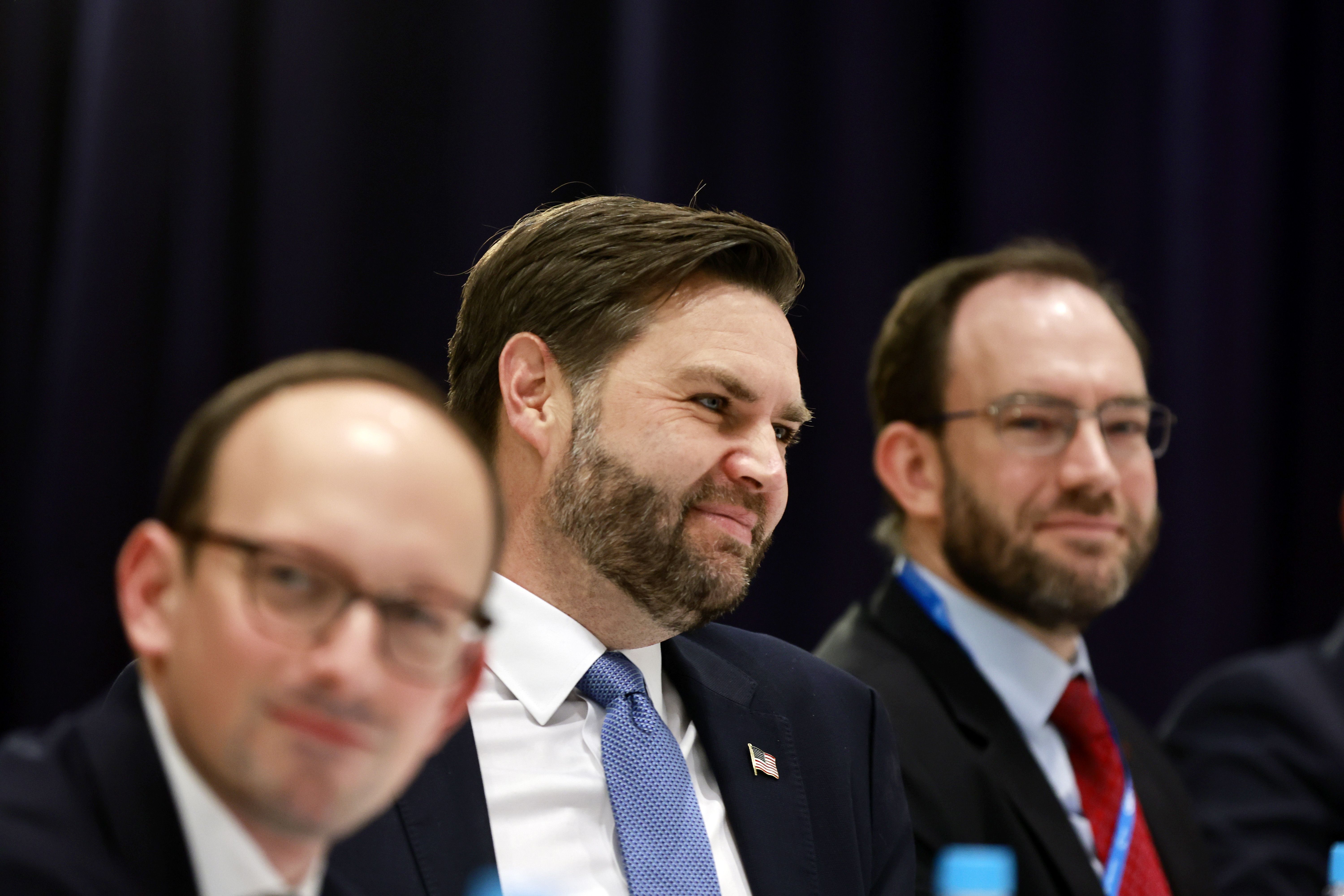 Andy Baker (right, with beard) advised Vice President Vance at the Munich Security Conference last year.