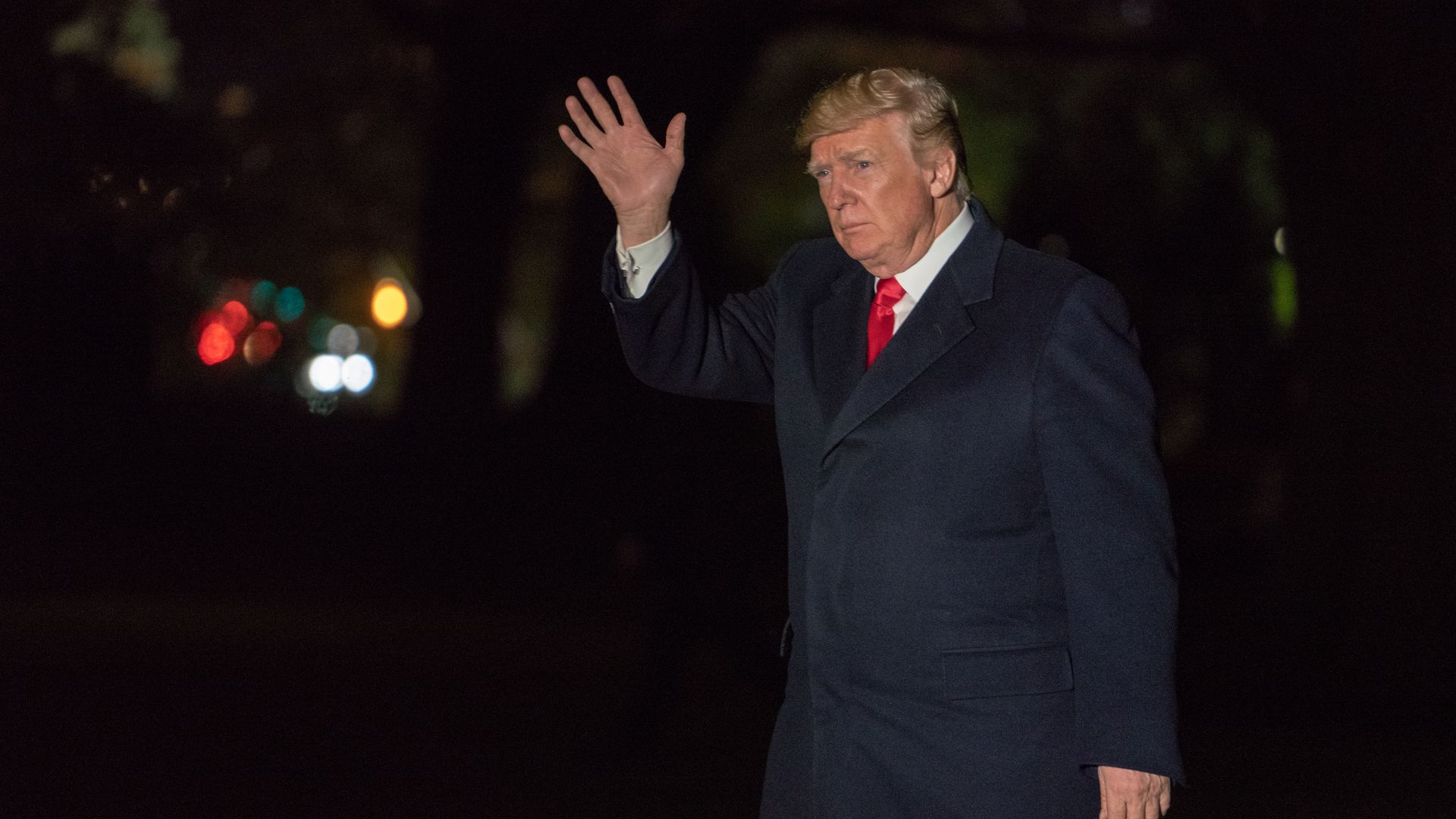 Donald Trump gets off a helicopter