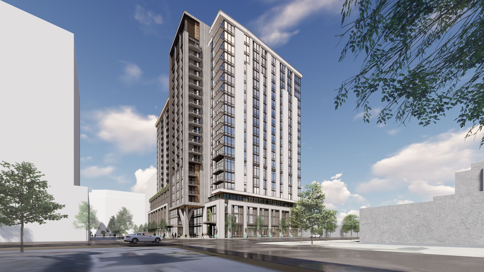 Modern high-rise building with large windows and balconies under a blue sky, surrounded by trees and streets with a car and people nearby.