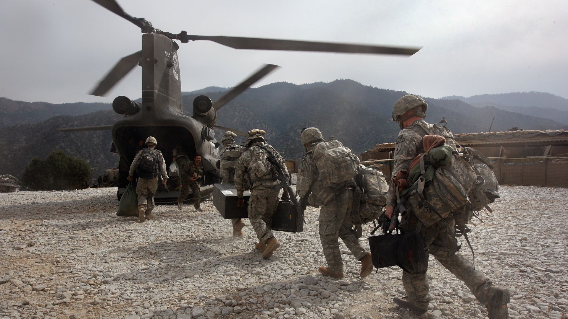 U.S. soldiers boarding a helicopter in the Korengal Valley, Afghanistan, in October 2008.
