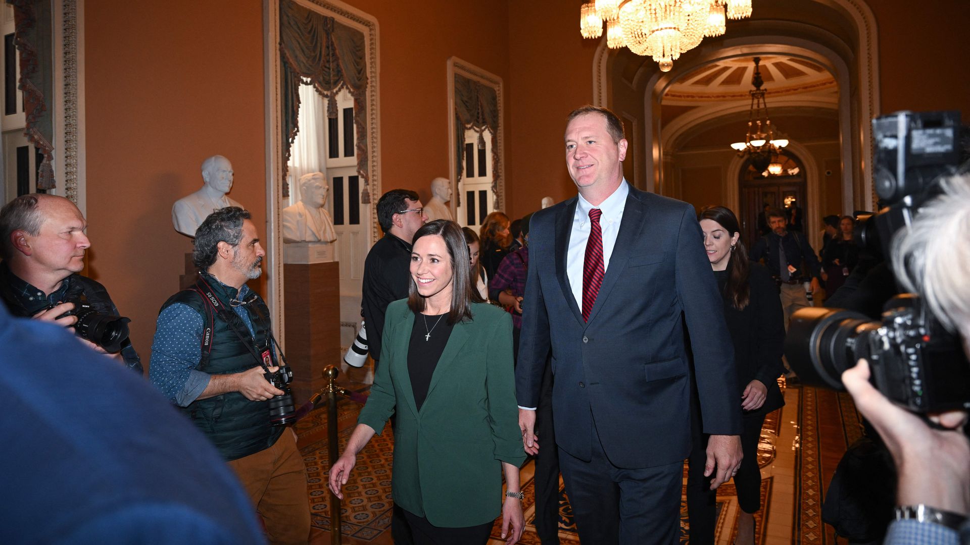 Katie Britt (C L), of Alabama; and Eric Schmitt (C R), of Missouri, walk to the office of Senate Minority Leader Mitch McConnell at the US Capitol