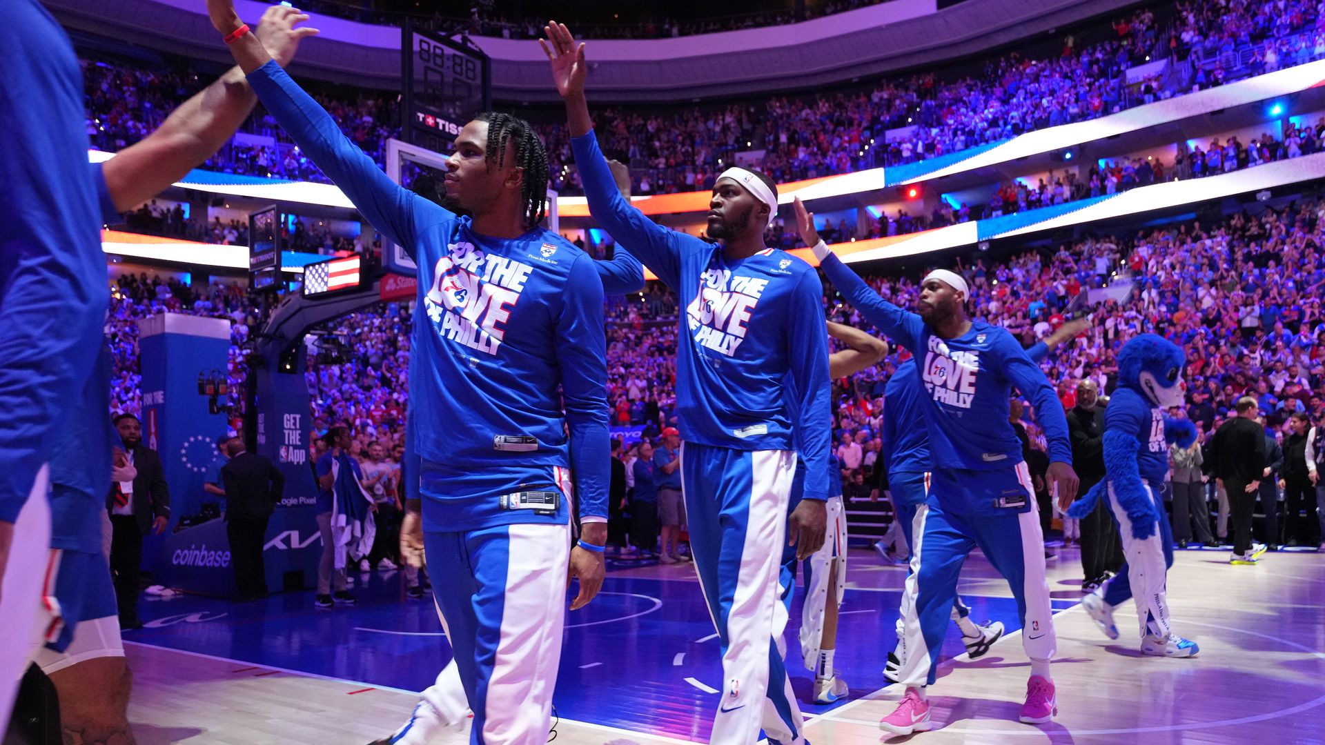 Philadelphia 76ers line up to high five each other before a playoff game against the New York Knicks.