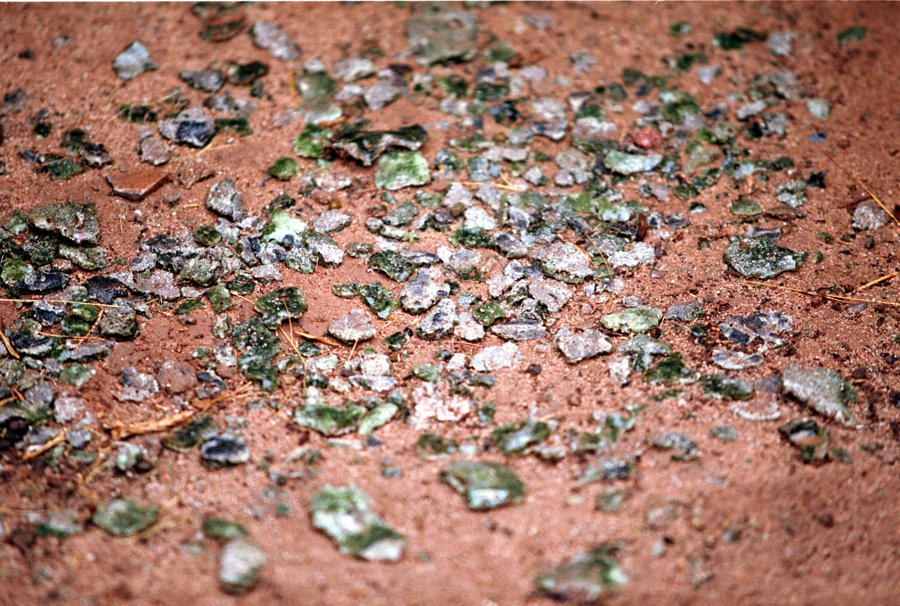 Trinitite, the green, glassy substance at The Trinity Site, scattered at ground zero.