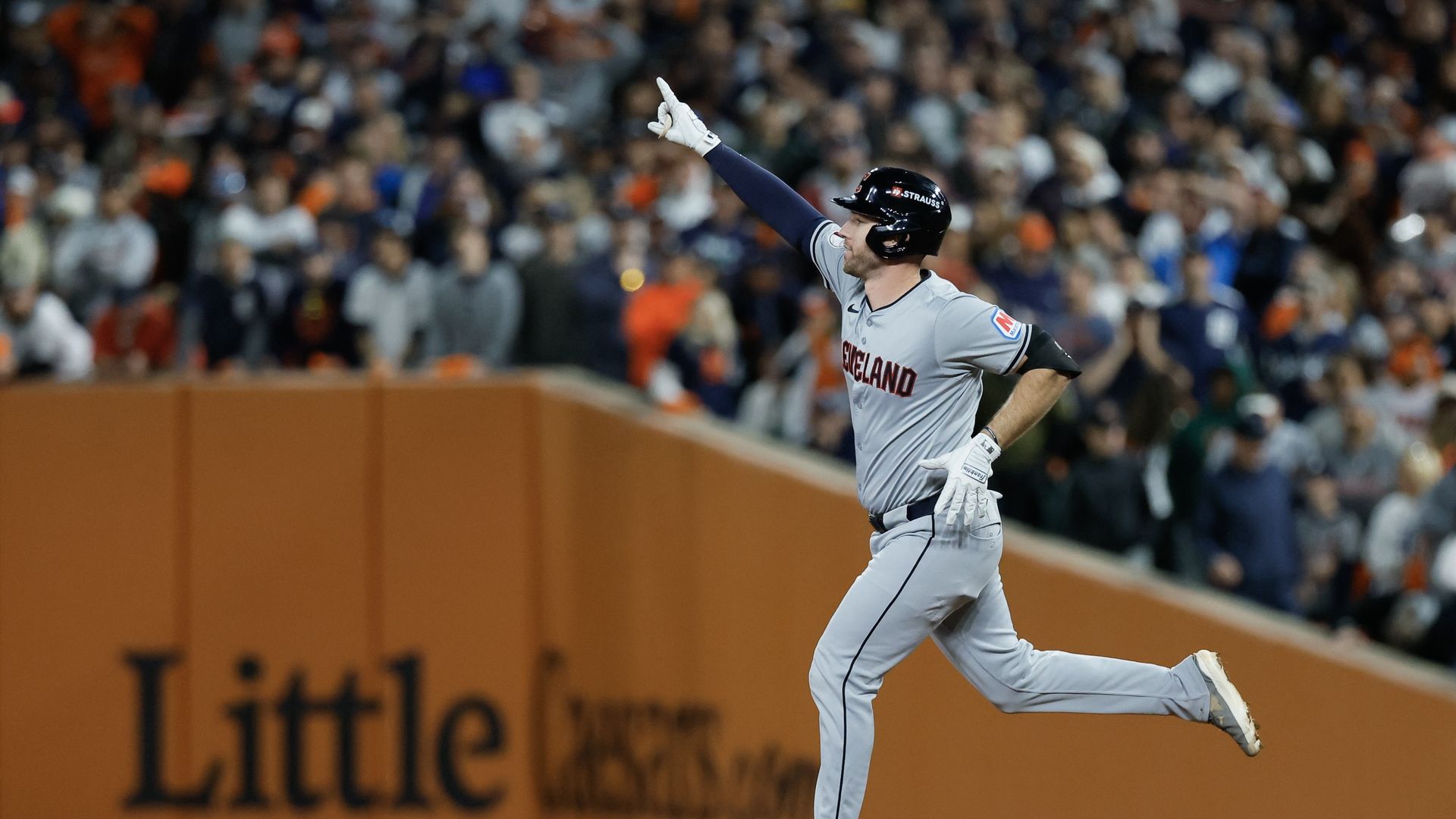 Guardians hitter David Fry rounds the bases after a home run.