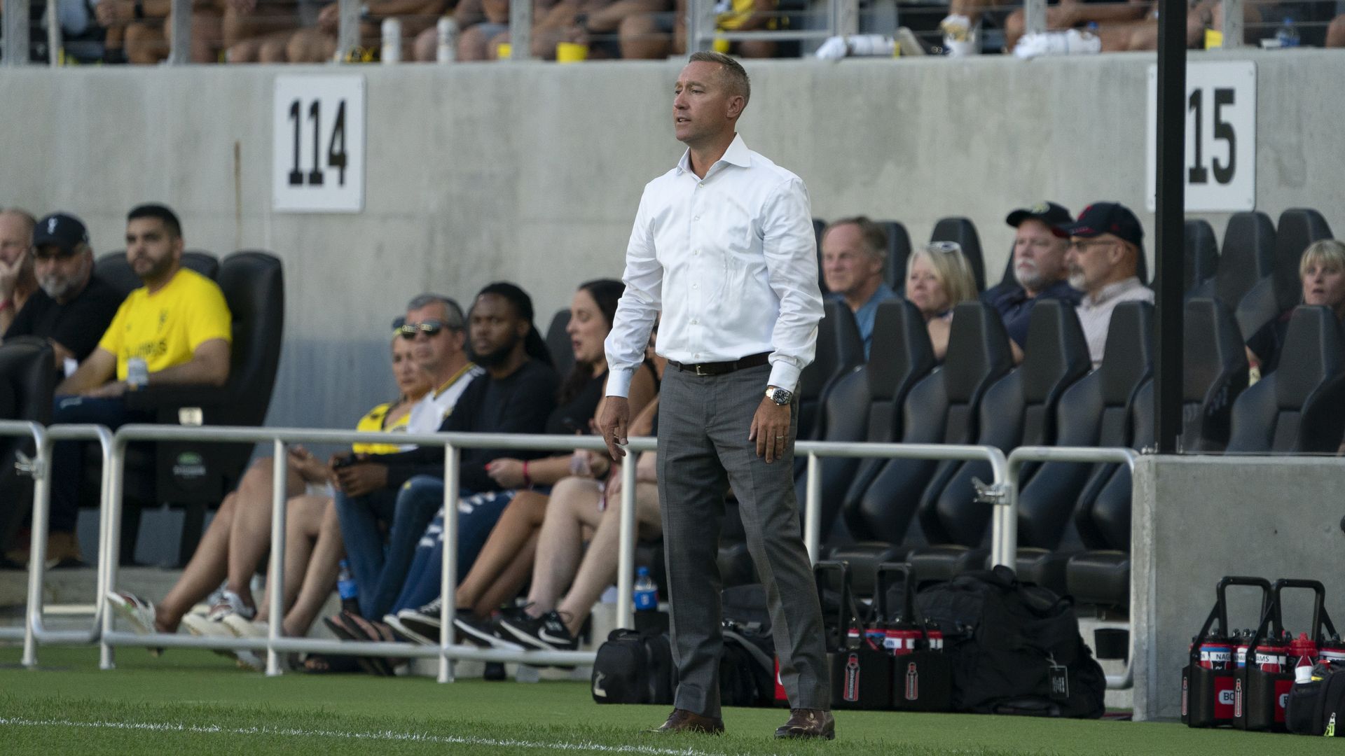 Crew head coach Caleb Porter stands on the field during a match