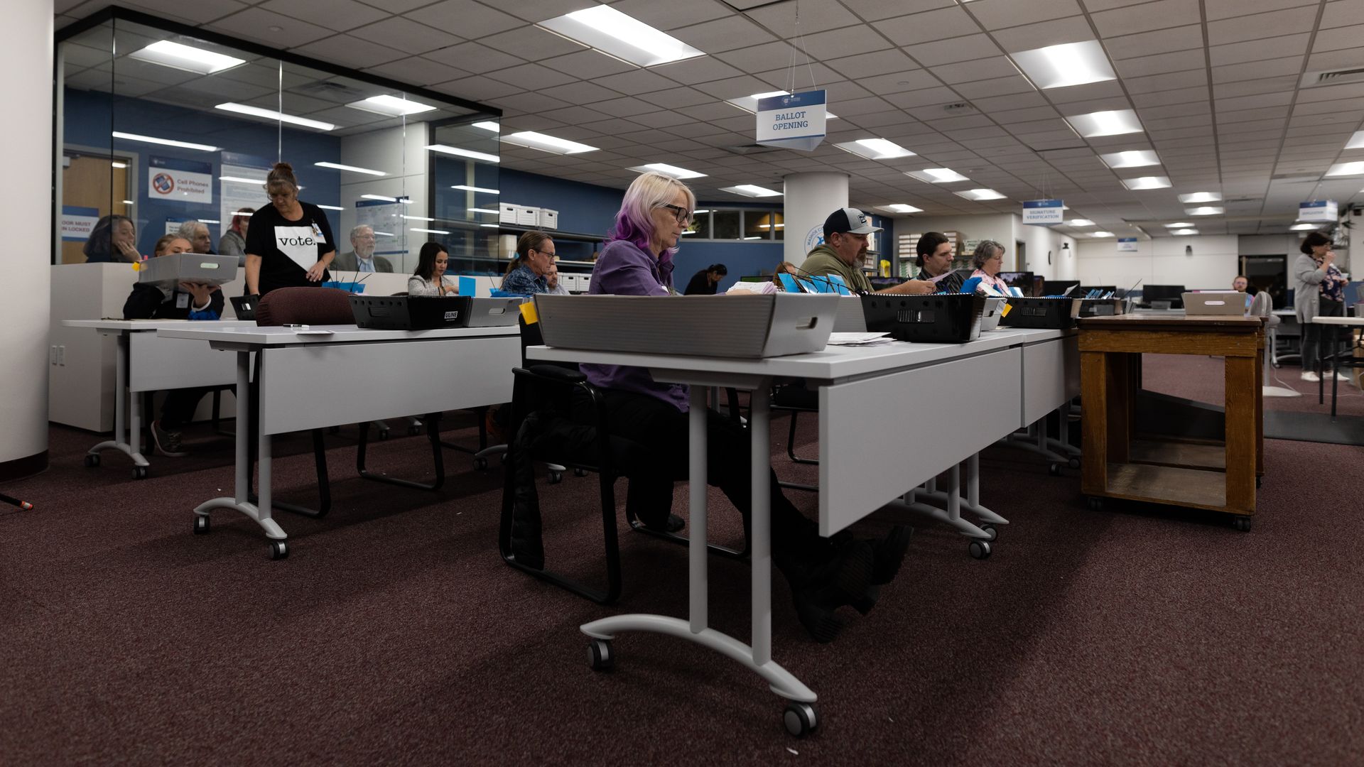 Election officials sort mail-in ballots at the Washoe County Registrar of Voters Office on Nov. 8, 2022 in Reno, Nev.