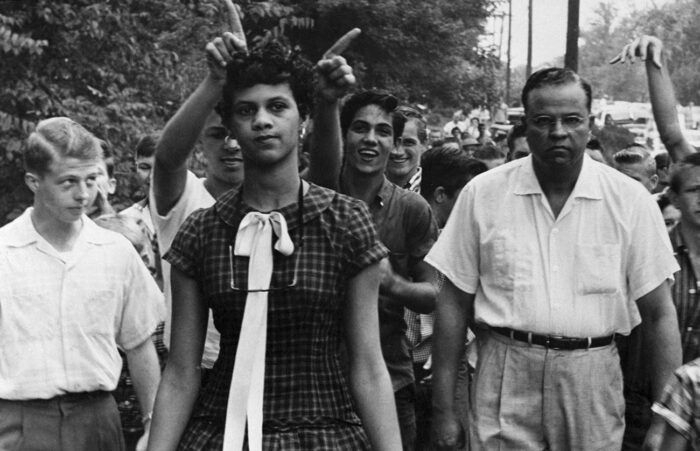 A crowd of people taunt Dorothy Geraldine Counts, 15, as she walks to a previously all-white Harding High School to enroll. Photo: Getty Images