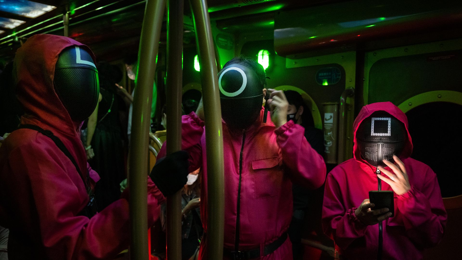 people dressed up as characters from Netflix show Squid Game