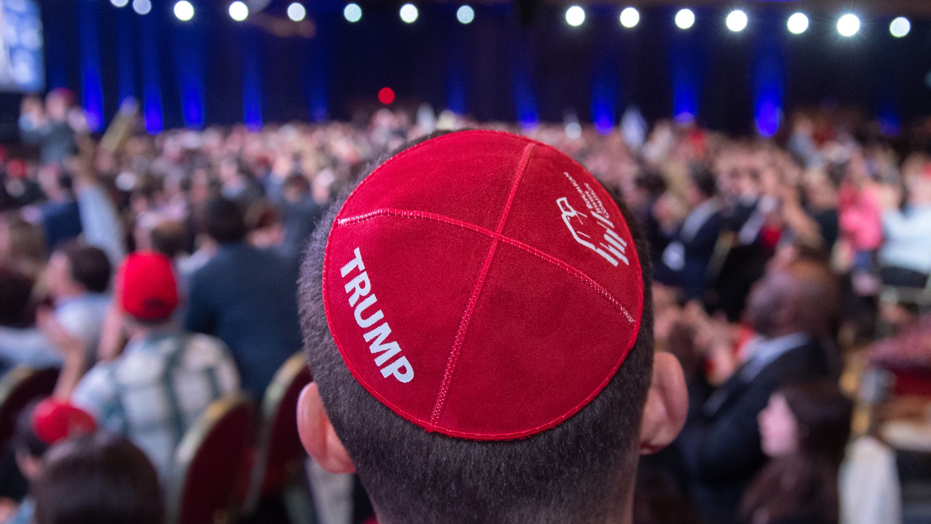 A man wears a Trump yarmulke prior to a speech by Trump during the Republican Jewish Coalition. 