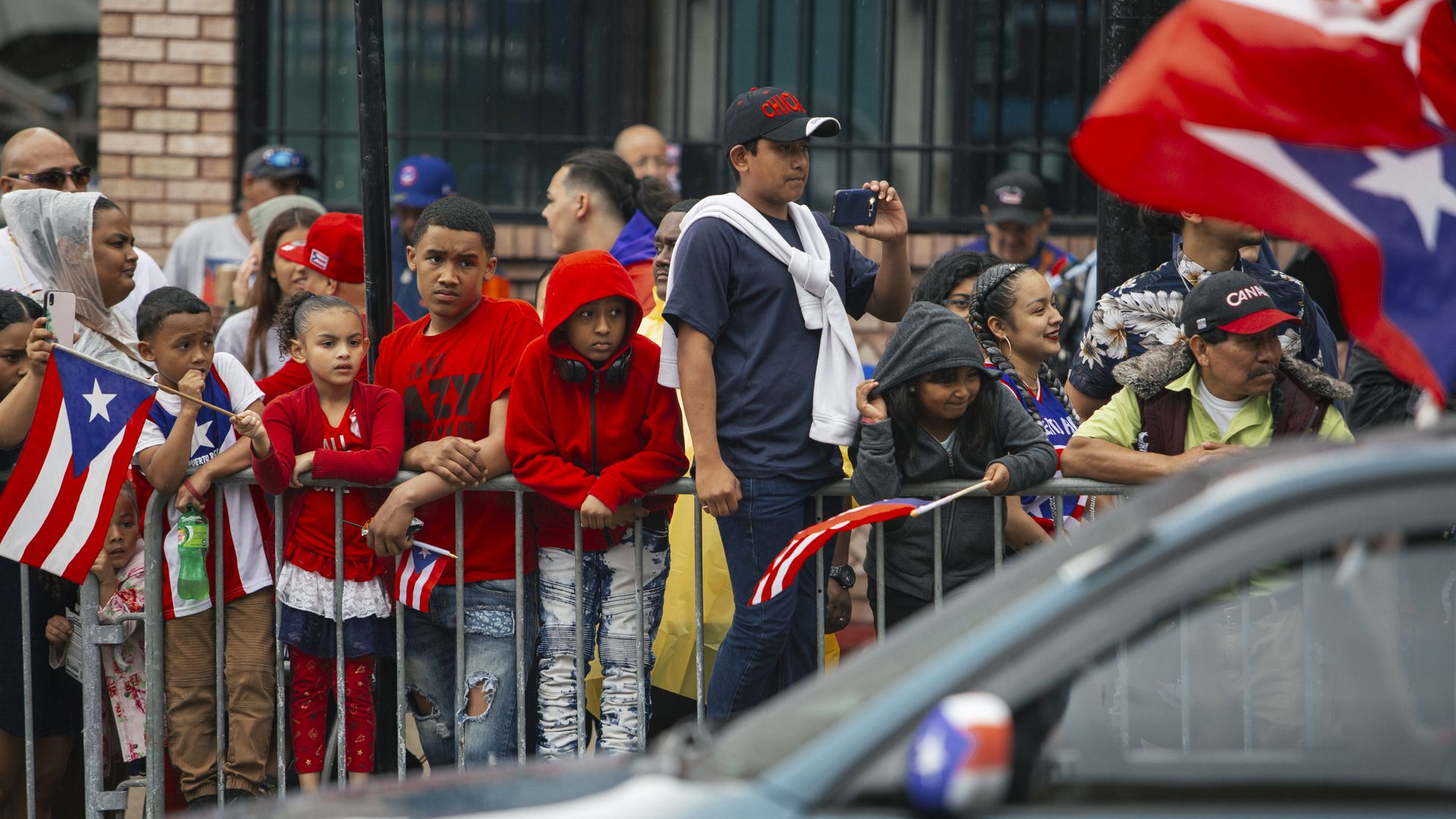 people watching a puerto rican parade