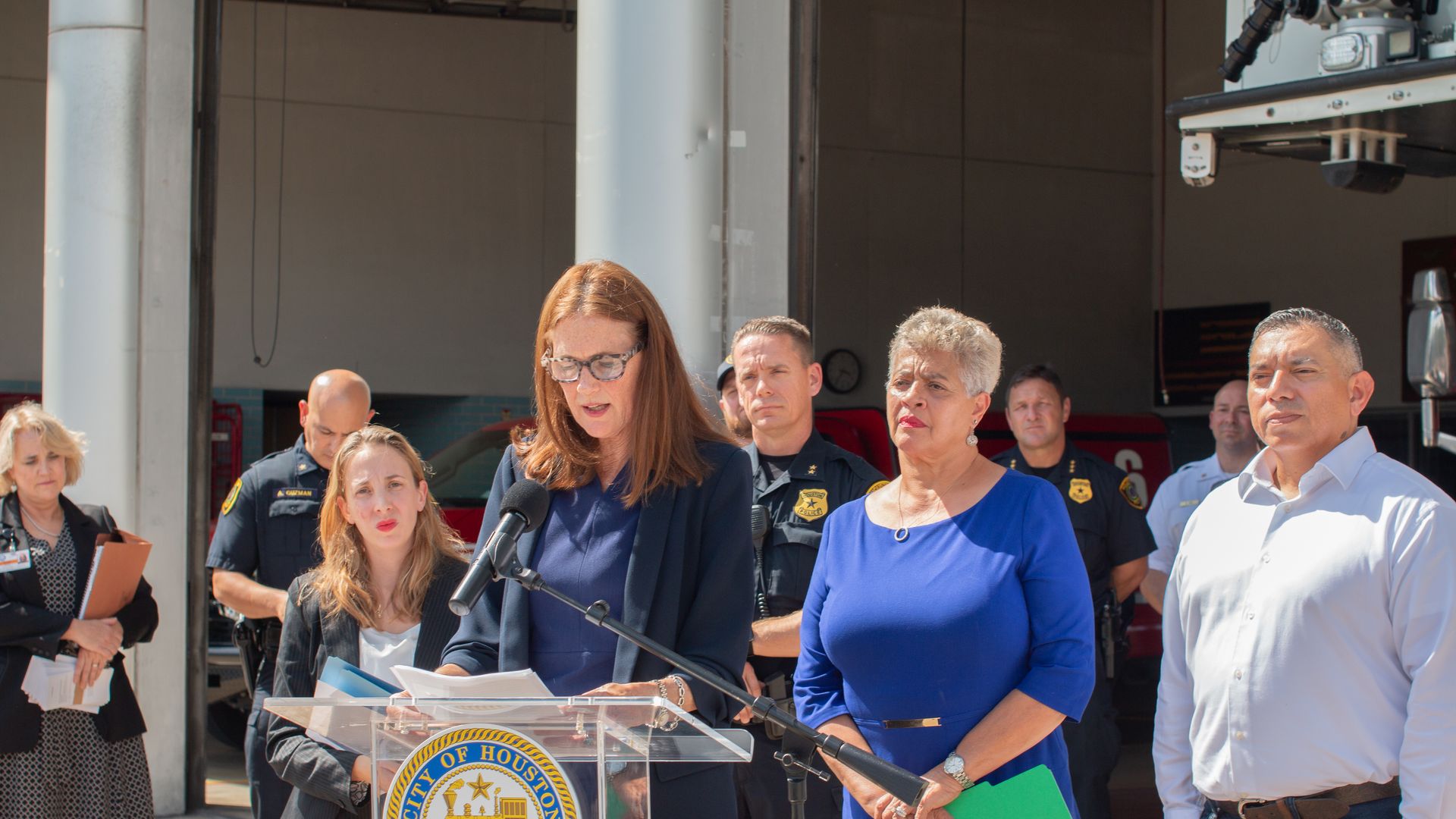 Sallie Alcorn, a Houston city council member, speaks at a podium during a press conference