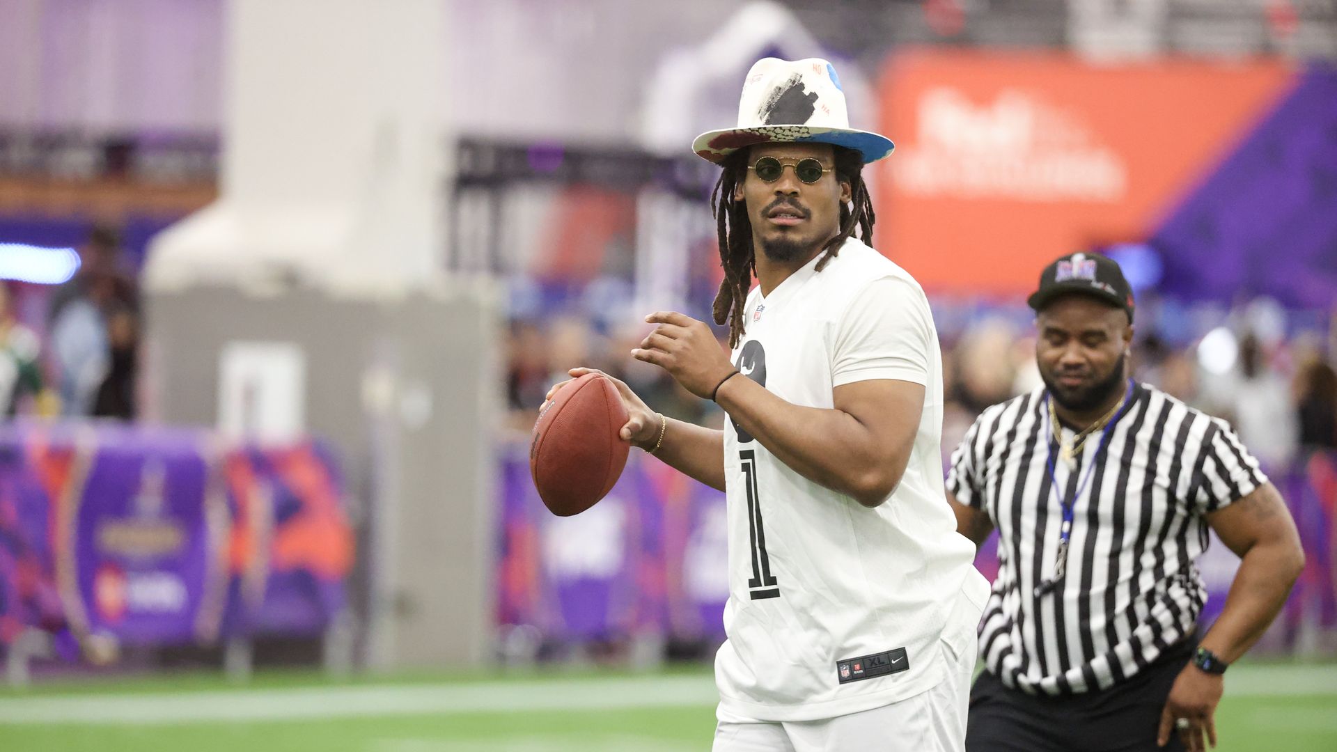 Former NFL quarterback Cam Newton attempts a pass during a celebrity flag football game at the Mandalay Bay Convention Center on February 09, 2024 in Las Vegas, Nevada.