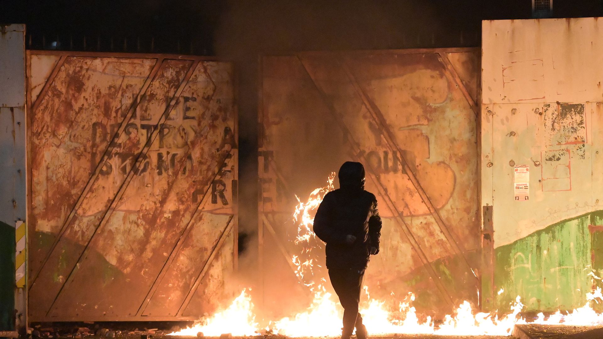 Nationalists and Loyalists riot against one another at the Peace Wall interface gates which divide the two communities on April 7, 2021 in Belfast