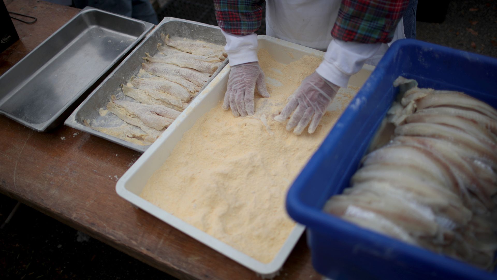 A worker gets ready for Democratic presidential candidates yesterday at the Finkenauer Fish Fry in Cedar Rapids, Iowa.