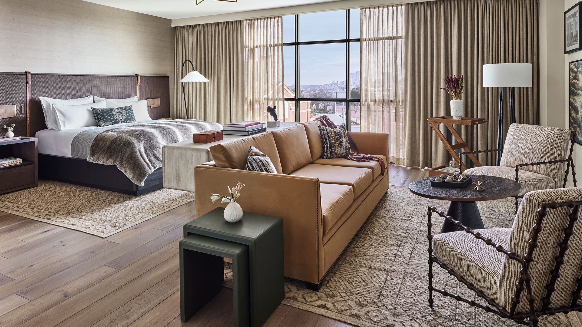 A hotel room with a bed and seating area