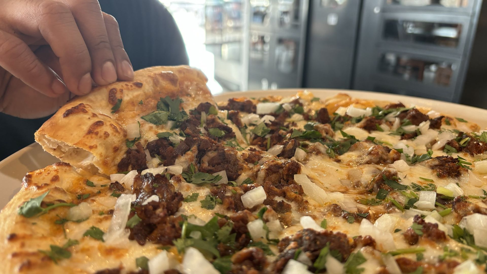 Lulu Oven's birria pizza. Photo: Kim Bojórquez/Axios