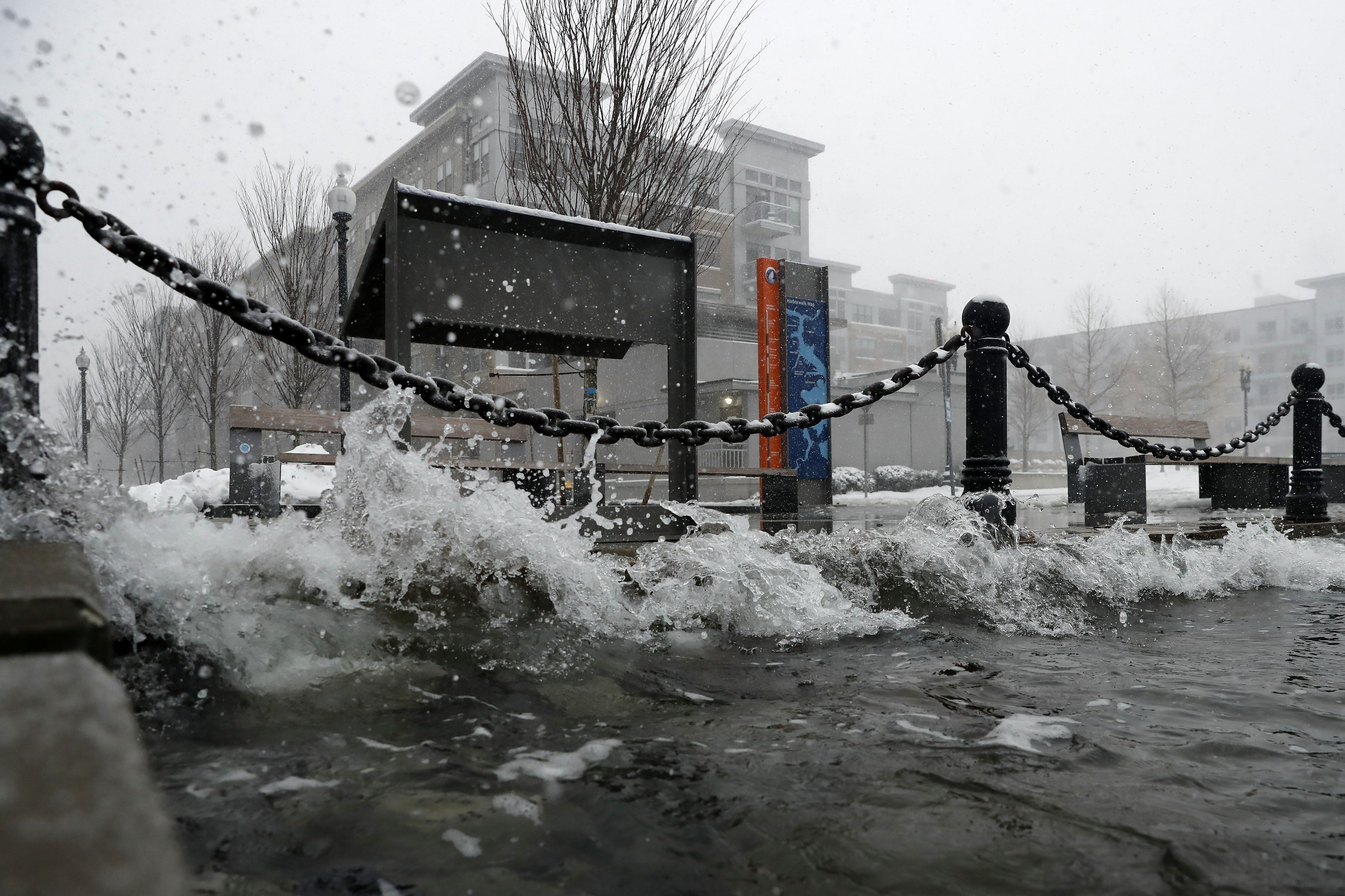 Water reaches flood level, Saturday, Jan. 29, 2022, in the East Boston neighborhood of Boston. 