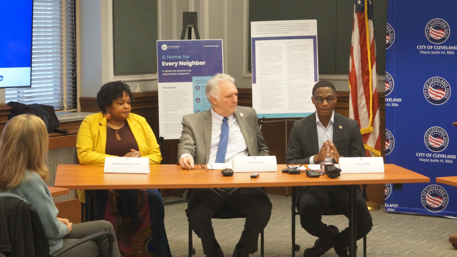 A photo of three leaders sitting at a table. L-R: Cleveland City Councilwoman Stephanie Howse-Jones, Cuyahoga County Exec Chris Ronayne, Cleveland Mayor Justin Bibb