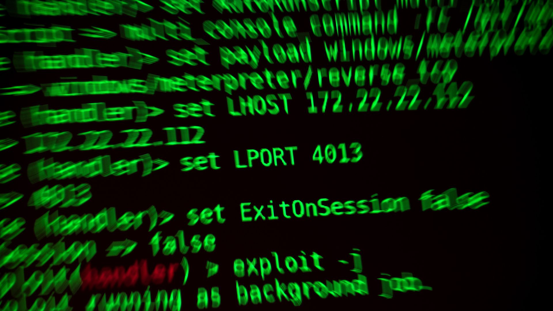 A photo of a computer screen displaying code for a hacking program