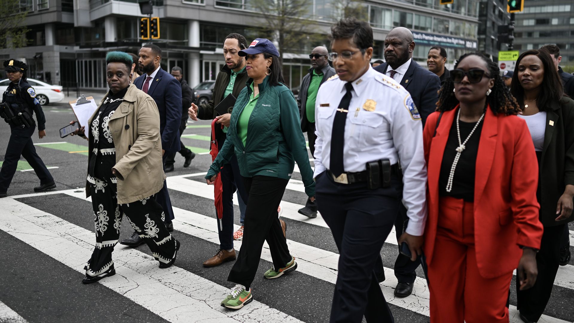 Mayor Bowser and Police Chief Smith on a public safety walk with other people around them