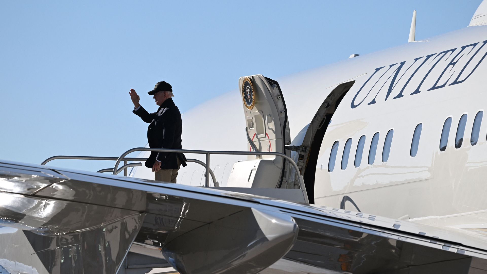 Biden waves as he steps off Air Force One