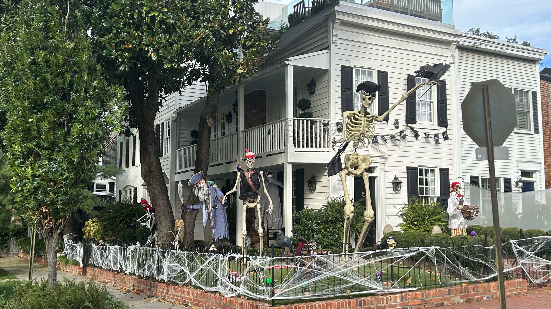 georgetown dc yard with giant skeletons dressed as pirates for halloween