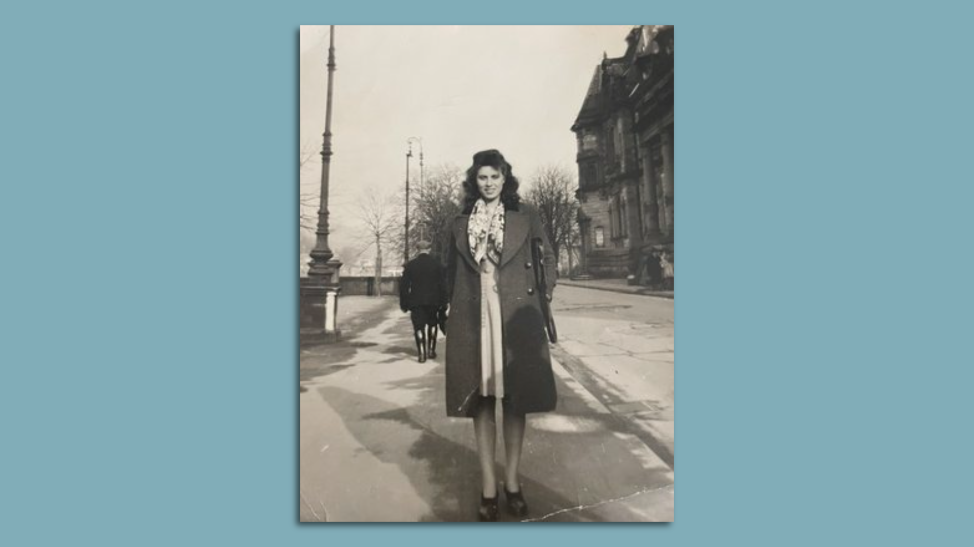 Old photo of a woman posing for camera. 
