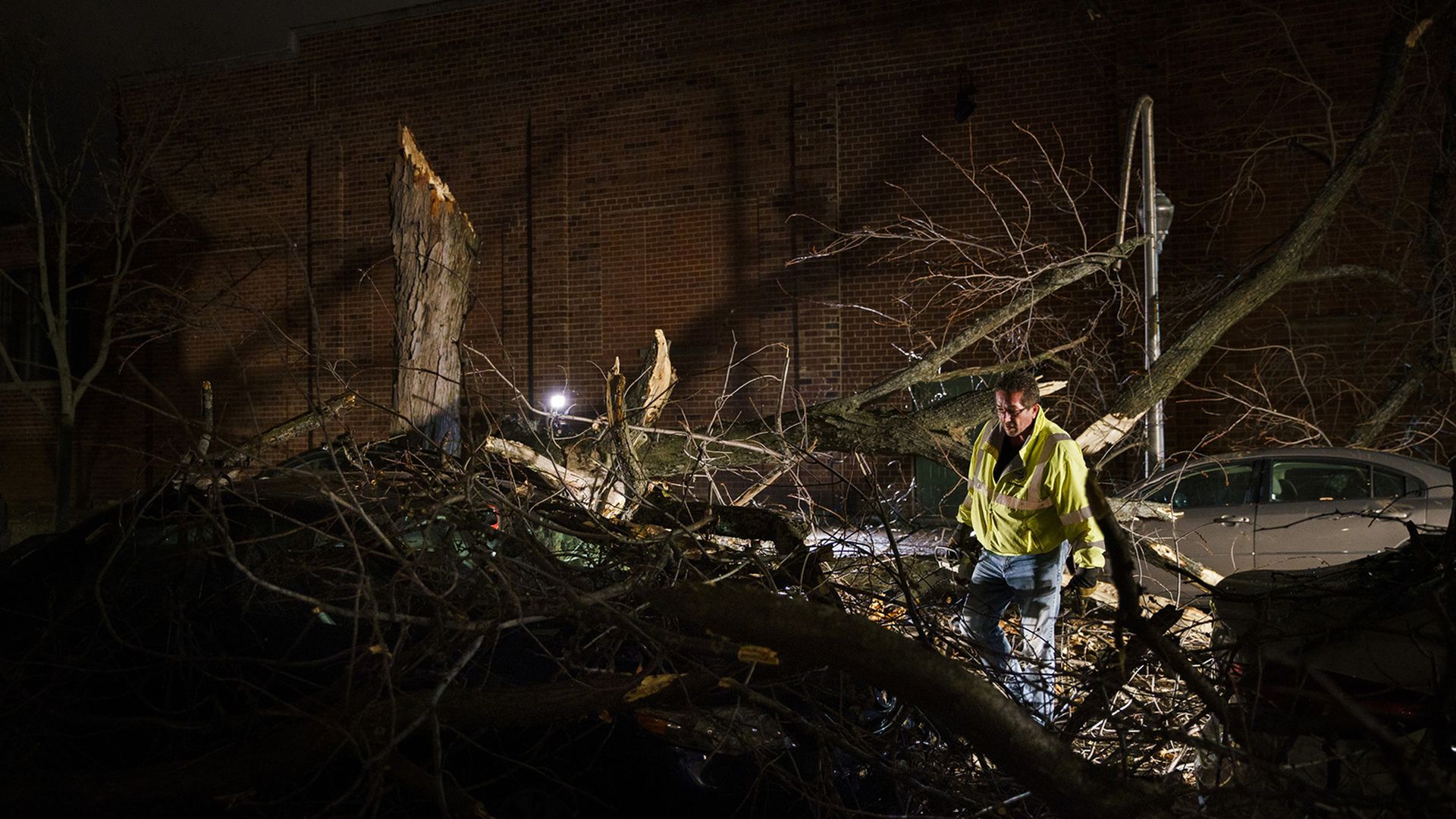 Photo of a person wading through rubble