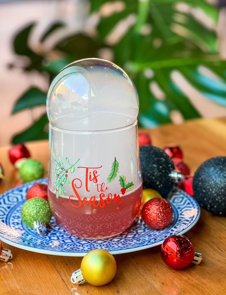 a glass that says tis the season 